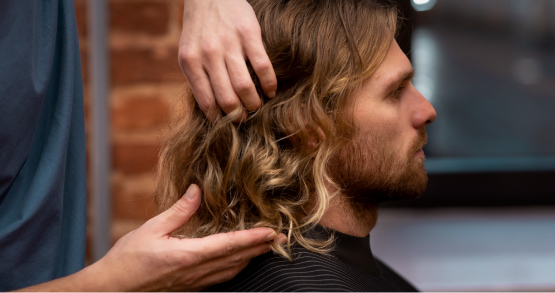 Stylist giving a modern haircut for men in Whitefield, Bangalore