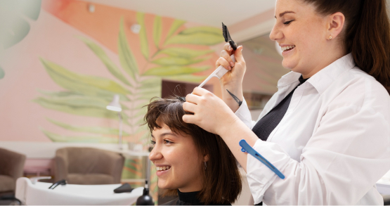 Stylist performing hair treatment in Kadubeesanahalli salon