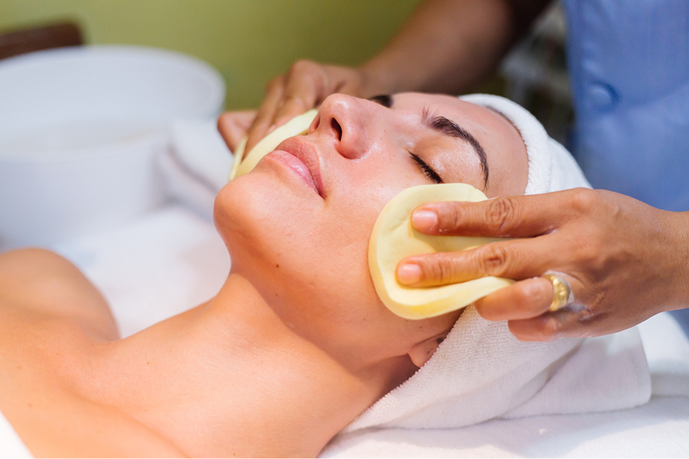 Woman enjoying a relaxing facials in Mahadevapura at SAS Unisex Salon