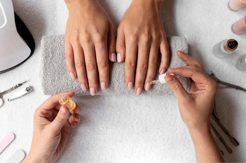 Nail technician performing professional manicure and pedicure in Whitefield, Bangalore