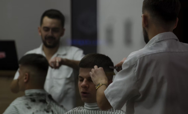 Barber giving stylish haircut for men in Banaswadi, Bangalore