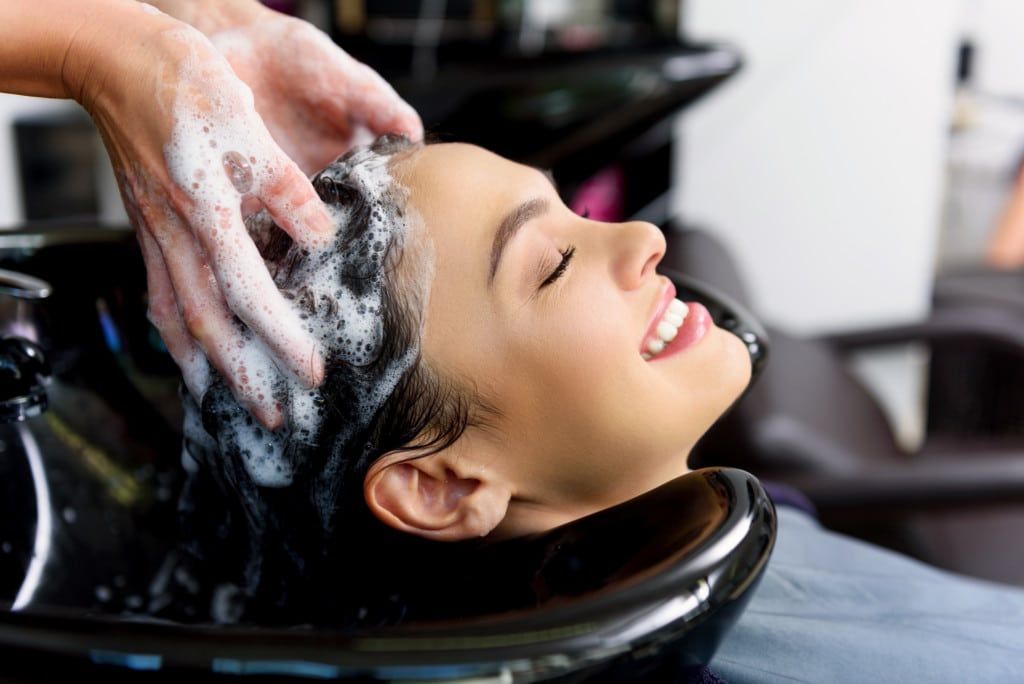 Professional stylist performing hair treatments in HSR Layout, Bangalore