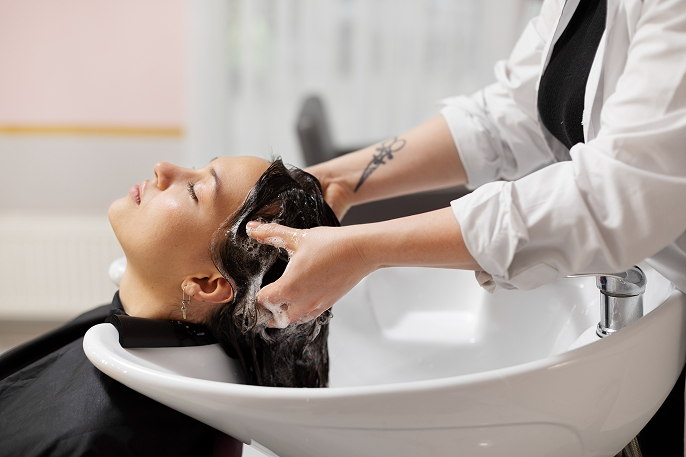Stylist applying premium hair treatment in Banaswadi, Bangalore